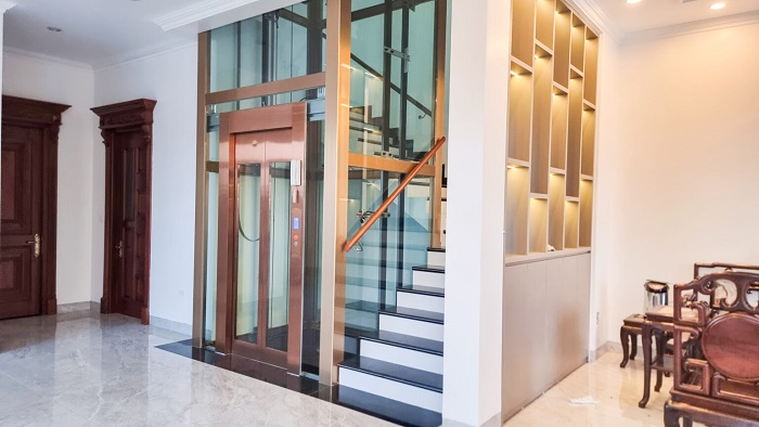 Thang máy kính Inox gương đồng khung nhôm