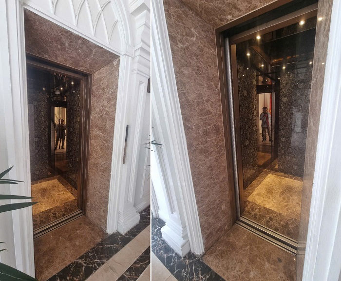 Hai bên vách cabin Inox vàng gương xen kính cường lực hoa văn